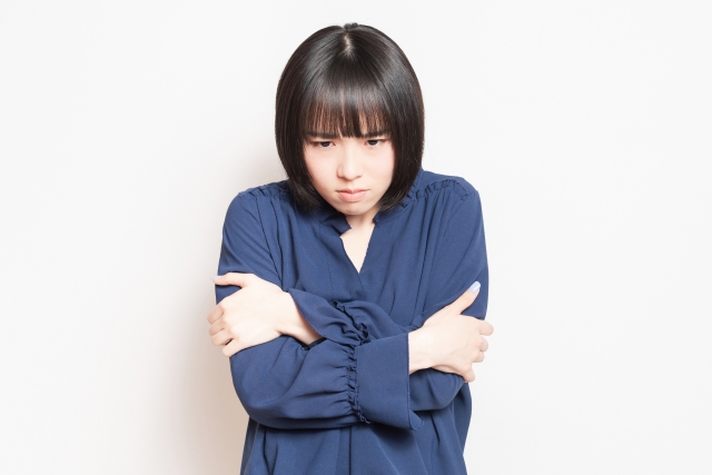 体調の悪い女性